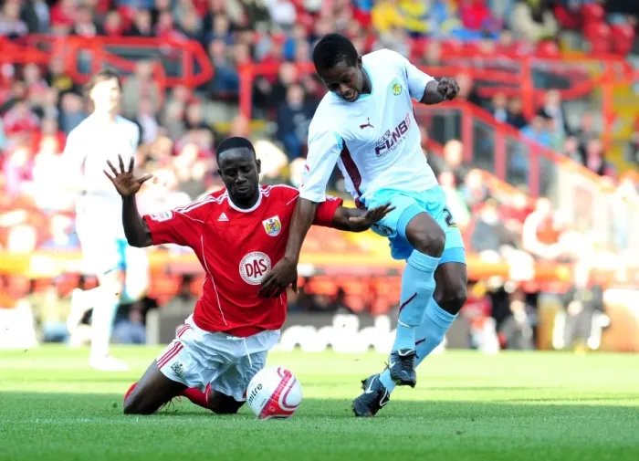 Framed Print : Adomah vs Bartley: Battle for Supremacy in the Championship Clash between Bristol City and Burnley (19-03-2011)