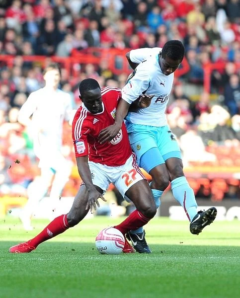 Adomah vs Bartley: Intense Battle for Control in the 2011 Championship Clash between Bristol City and Burnley