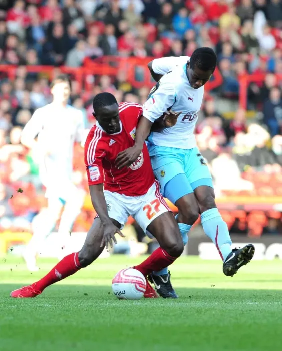 Framed Print : Adomah vs Bartley: Intense Battle for Control in the 2011 Championship Clash between Bristol City and Burnley Framed Print : Adomah vs Bartley: Intense Battle for Control in the 2011 Championship Clash between Bristol City and Burnley