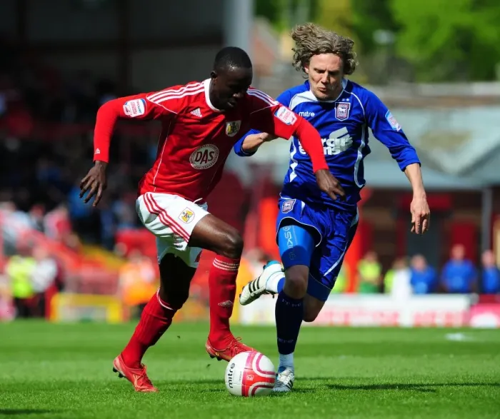 Framed Print : Adomah vs Bullard: Intense Battle for the Ball in the Championship Clash between Bristol City and Ipswich Town (16-04-2011)