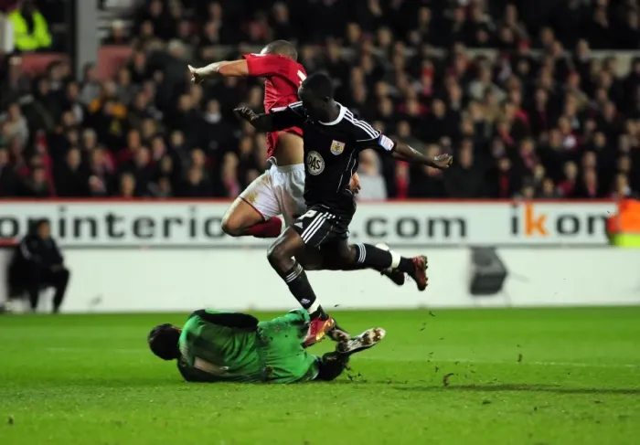 Framed Print : Adomah vs. Camp: Intense Battle for the Ball in Nottingham Forest vs. Bristol City Championship Clash Framed Print : Adomah vs. Camp: Intense Battle for the Ball in Nottingham Forest vs. Bristol City Championship Clash
