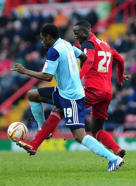 Adomah vs. Carayol: Intense Battle in Bristol City vs. Middlesbrough Football Match, 09 / 03 / 2013