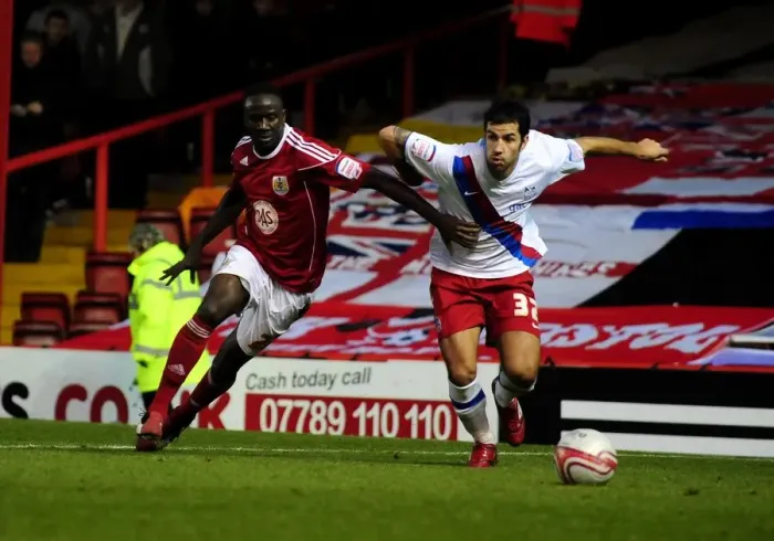 Framed Print : Adomah vs. Counago: Battle for the Ball in the Championship Clash between Bristol City and Crystal Palace (December 2010)