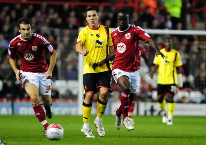 Framed Print : Adomah vs. Cowie: Intense Battle for the Ball in Bristol City vs. Watford Championship Match Framed Print : Adomah vs. Cowie: Intense Battle for the Ball in Bristol City vs. Watford Championship Match