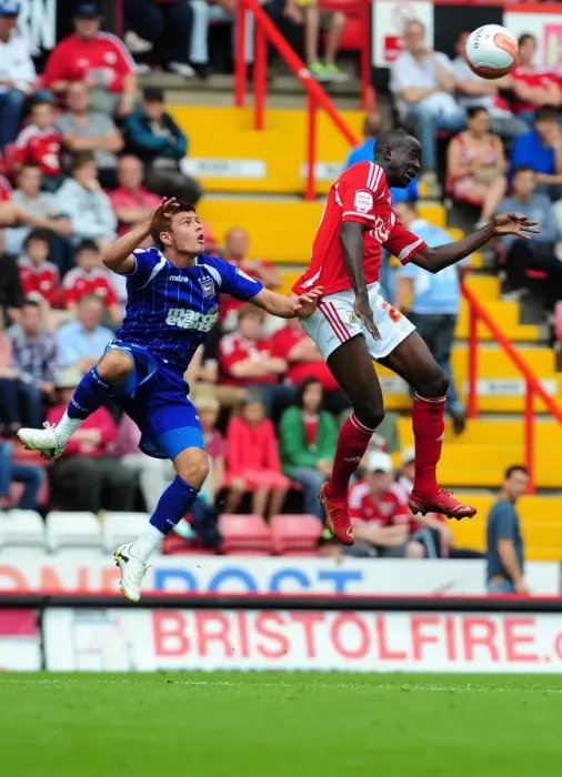 Framed Print : Adomah vs. Cresswell: Intense Aerial Battle in the Championship Clash between Bristol City and Ipswich Town (06 / 08 / 2011) Framed Print : Adomah vs. Cresswell: Intense Aerial Battle in the Championship Clash between Bristol City and Ipswich Town (06 / 08 / 2011)