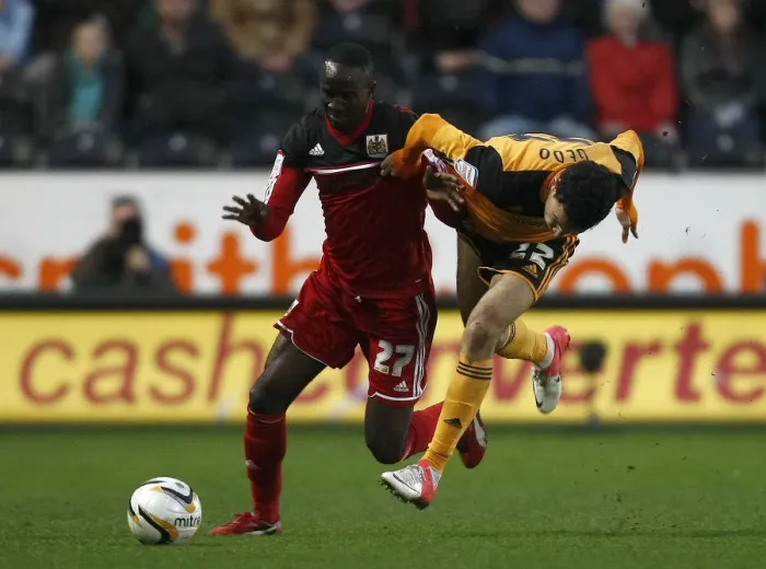 Framed Print : Adomah vs Gedo: Intense Battle on the Football Field - Hull City vs Bristol City, 2013