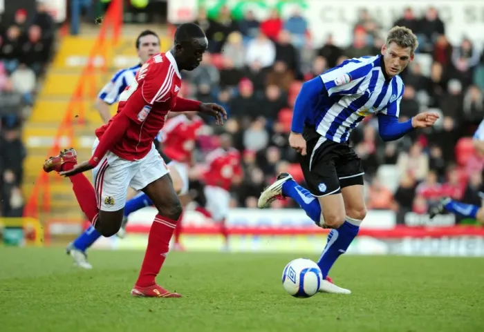 Framed Print : Adomah vs Jones: Intense Battle for the Ball in FA Cup Match between Bristol City and Sheffield Wednesday