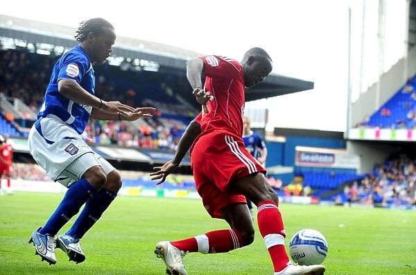 Adomah vs. Peters: Battle for Ball Possession in Ipswich v Bristol City Championship Clash (August 2010)