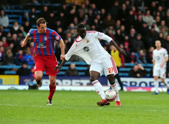 Framed Print : Adomah vs. Wright: Intense Battle for Ball Possession in Crystal Palace vs. Bristol City Championship Clash, Selhurst Park, 2011