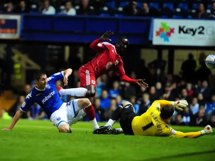 Framed Print : Adomah's Shot Savied: Portsmouth Keeps Bristol City at Bay as Jamie Ashdown Denies Albert Adomah's Goal Attempt - Championship 2010