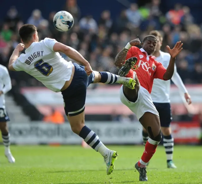 Framed Print : Agard vs. Wright: Intense Battle for the Ball in Preston North End vs. Bristol City