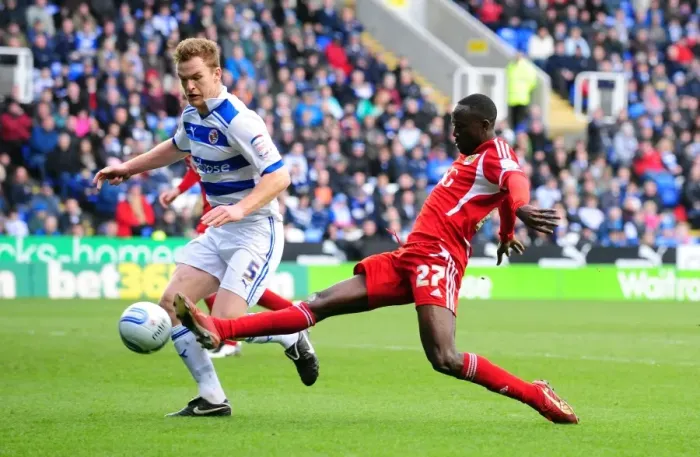 Framed Print : Albert Adomah of Bristol City Stretches for the Ball against Alex Pearce of Reading in Championship Match, 2012