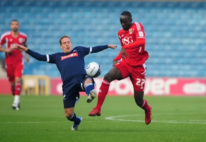 Framed Print : Albert Adomah Evasive Move Against Brian Howard in 2011 Millwall vs. Bristol City Championship Match