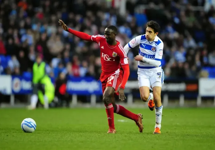 Framed Print : Albert Adomah Fouled by Jem Karacan in Reading vs. Bristol City Championship Match, 2012