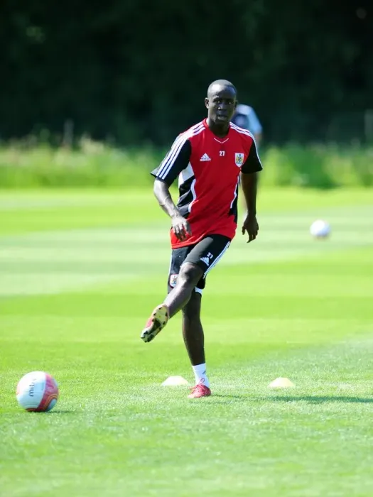 Framed Print : Albert Adomah's Unwavering Focus: Braving the Elements in Bristol City's Pre-season Training