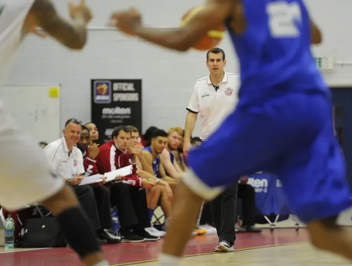 Framed Print : Andreas Kapoulas Leads the Charge: Intense Basketball Action at SGS Wise Campus - Flyers vs. Raiders
