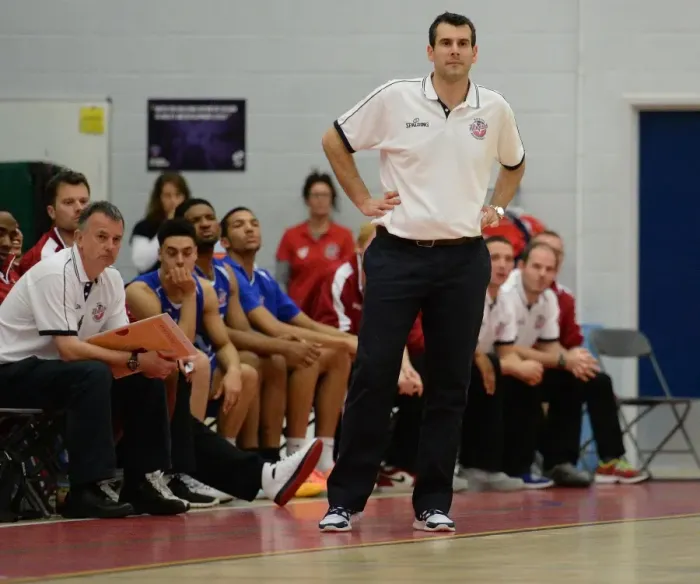 Framed Print : Andreas Kapoulas Leads the Charge: Intense Moment from Bristol Flyers vs. Sheffield Sharks Basketball Game