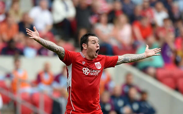 Appeal for Victory: Lee Tomlin of Bristol City Fights for Goal against Aston Villa