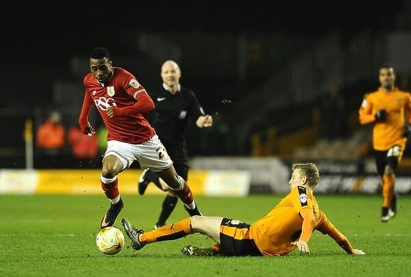 Avoiding a Tackle: Kodjia Eves Dangerously Past Saville in Wolves vs. Bristol City Clash