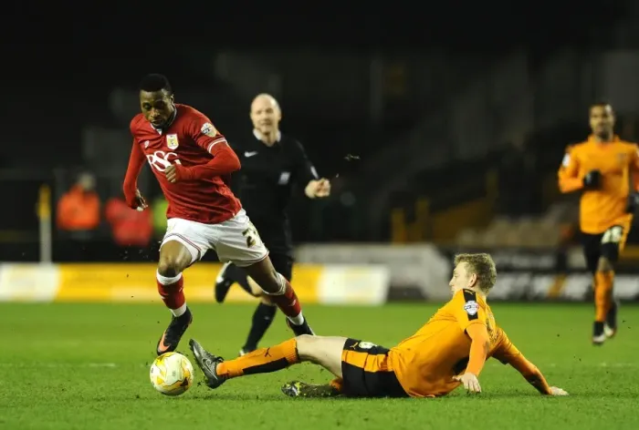 Framed Print : Avoiding a Tackle: Kodjia Eves Dangerously Past Saville in Wolves vs. Bristol City Clash