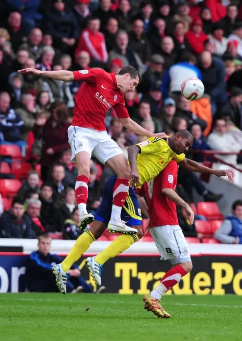 Framed Print : Barnsley vs. Bristol City: Intense Battle for the High Ball in Championship Match, October 2011