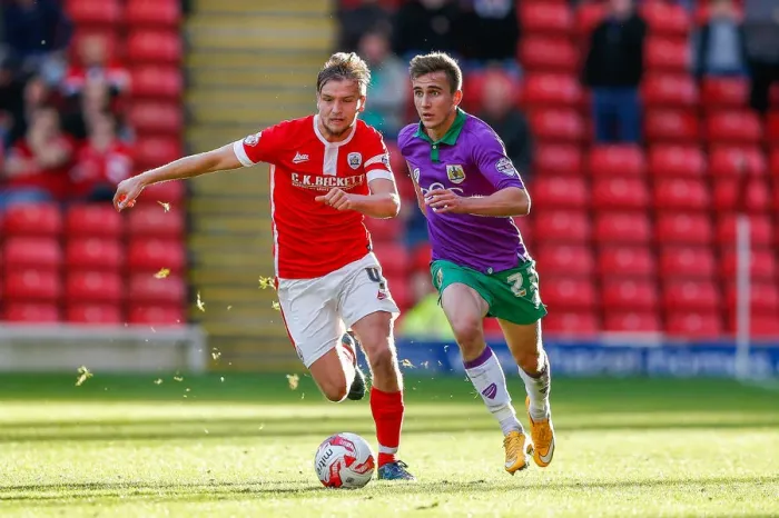 Framed Print : Barnsley vs. Bristol City: Joe Bryan Faces Off Against Luke Berry