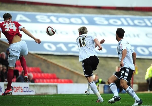 Barnsley's John Stones Blocks Martyn Woolford's Goal: A Controversial Moment from Barnsley v Bristol City Championship Match, September 1, 2012