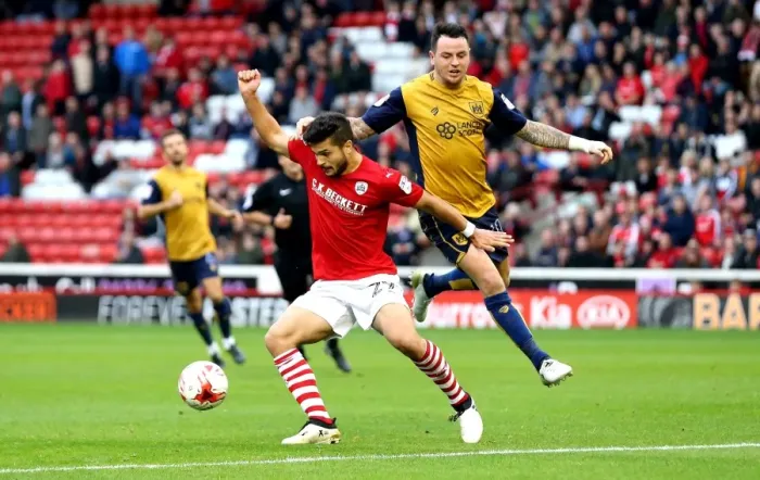 Framed Print : Barnsley's Sam Morsy Holds Off Bristol City's Lee Tomlin in Championship Clash Framed Print : Barnsley's Sam Morsy Holds Off Bristol City's Lee Tomlin in Championship Clash
