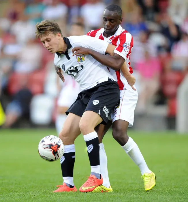 Framed Print : Battle for Control: Luke Freeman vs. Omari Sterling-James in the Cheltenham Town Clash (July 2014)