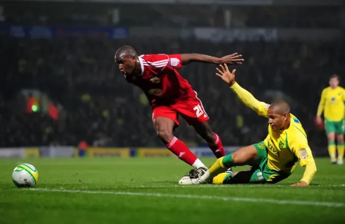 Framed Print : Battling for the Ball: Cisse vs. Jackson in Intense Norwich City vs. Bristol City Championship Clash, March 14, 2011