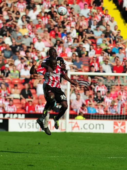 Framed Print : Battling for the Ball: Damion Stewart vs. Jordan Slew in Sheffield United vs. Bristol City Championship Clash (April 2011)