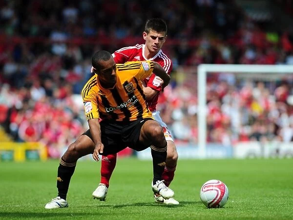 Battling for the Ball: Edwards vs. Simpson in the Intense Championship Clash between Bristol City and Hull City (07 / 05 / 2011)