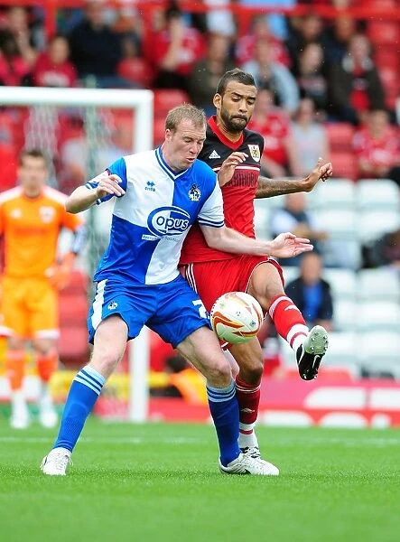 Battling for the Ball: Liam Fontaine vs. David Clarkson - Bristol City vs. Bristol Rovers, 2012 (Louis Carey Testimonial)