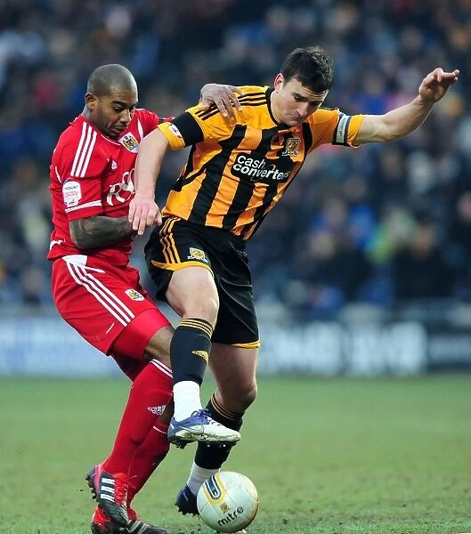 Battling for the Ball: Marvin Elliott vs. Jack Hobbs in Hull City vs. Bristol City Championship Clash - 11 / 02 / 2012