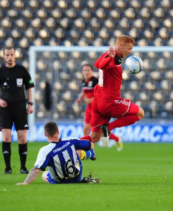 Framed Print : Battling for the Ball: Ryan Taylor vs Michael Nelson - Pre-Season Clash