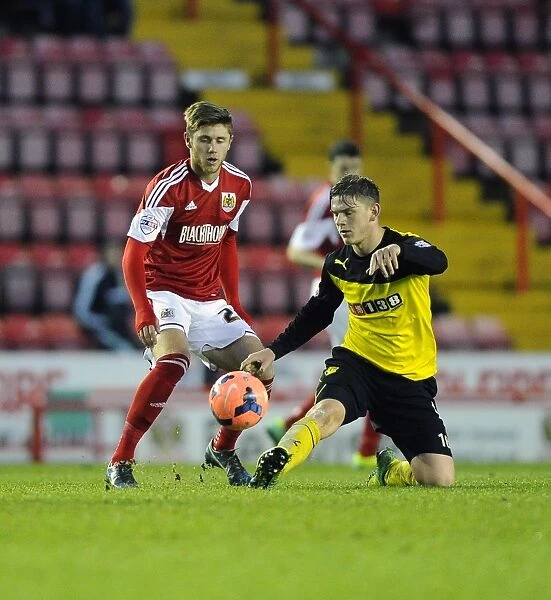Battling for the Ball: Wes Burns vs. Sean Murray in the FA Cup Third Round Clash between Bristol City and Watford