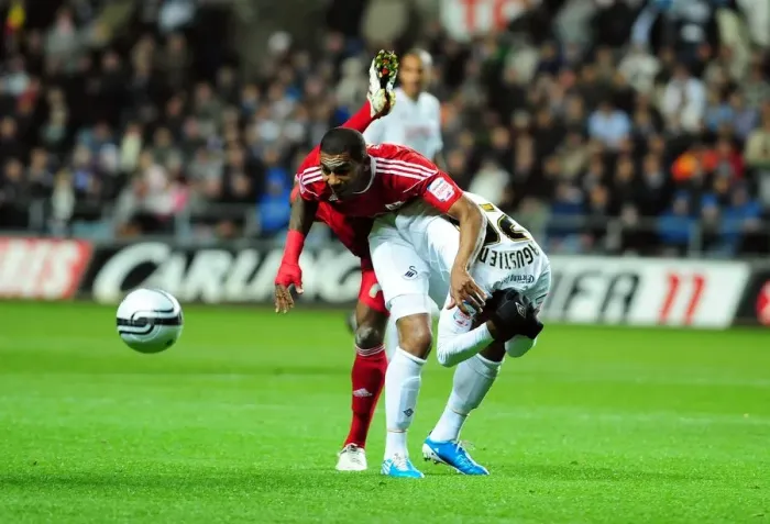 Framed Print : Battling for Championship Glory: Elliott vs. Agustien (10 / 11 / 2010) - Football Rivalry in the Championship: Swansea City vs. Bristol City Framed Print : Battling for Championship Glory: Elliott vs. Agustien (10 / 11 / 2010) - Football Rivalry in the Championship: Swansea City vs. Bristol City
