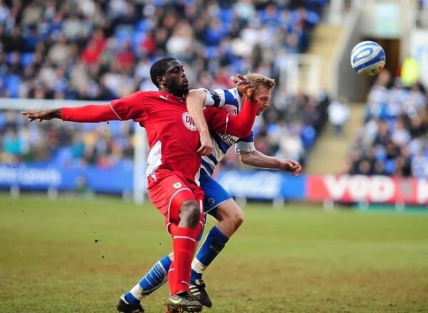Battling for Control: Akinde vs. Gunnarsson in the Intense Championship Showdown between Reading and Bristol City (13 / 03 / 2010)