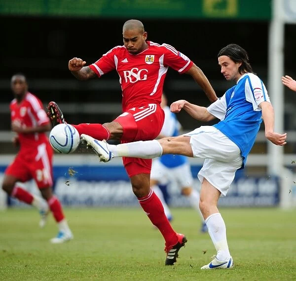 Battling for Control: Elliott vs. Boyd in Peterborough United vs. Bristol City Football Match