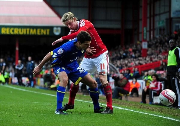 Battling for Control: Woolford vs. Lichaj in the Intense Championship Showdown between Bristol City and Leeds United (12 / 02 / 2011)