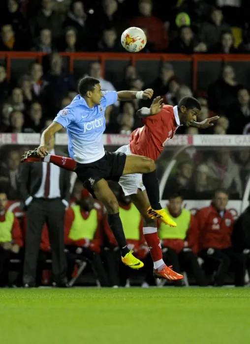 Framed Print : Battling for the High Ball: Mark Little vs. James Meredith - Sky Bet League One Clash Framed Print : Battling for the High Ball: Mark Little vs. James Meredith - Sky Bet League One Clash