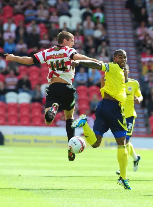 Framed Print : Battling for the High Ball: Marvin Elliott vs. Tommy Spurr - Doncaster Rovers vs. Bristol City (League Cup, 2011)