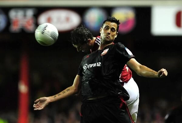 Battling for the High Ball: McAllister vs. Magera in the 2011 League Cup Clash (Bristol City vs. Swindon Town)