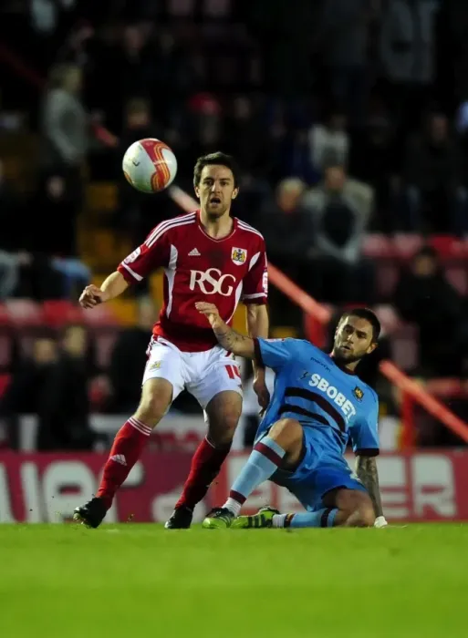 Framed Print : Battling Midfielders: Cole Skuse vs. Henri Lansbury in the Thrilling Bristol City vs. West Ham Clash at Ashton Gate Stadium (April 2012) Framed Print : Battling Midfielders: Cole Skuse vs. Henri Lansbury in the Thrilling Bristol City vs. West Ham Clash at Ashton Gate Stadium (April 2012)