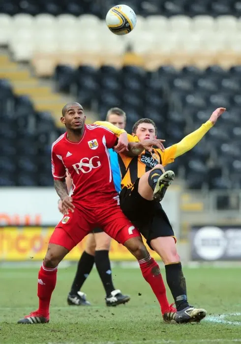 Framed Print : Battling Midfielders: Marvin Elliott vs. Corry Evans in Hull City vs. Bristol City Championship Clash - 11 / 02 / 2012