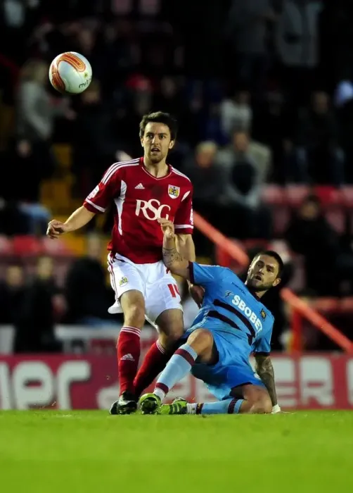 Framed Print : Battling Midfielders: Skuse vs. Lansbury at Ashton Gate, 2012 - A Football Rivalry Unfolds