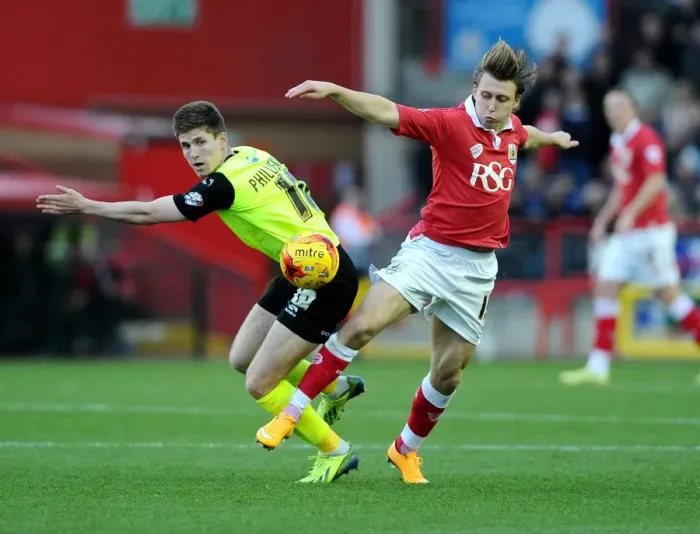 Framed Print : Battling for Possession: Luke Freeman vs. Daniel Philliskirk in Bristol City's Clash with Oldham Athletic
