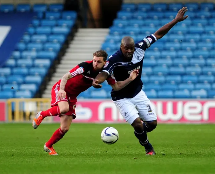 Framed Print : Battling for Possession: Paul Anderson vs. Danny Shittu in the Championship Clash between Millwall and Bristol City Framed Print : Battling for Possession: Paul Anderson vs. Danny Shittu in the Championship Clash between Millwall and Bristol City
