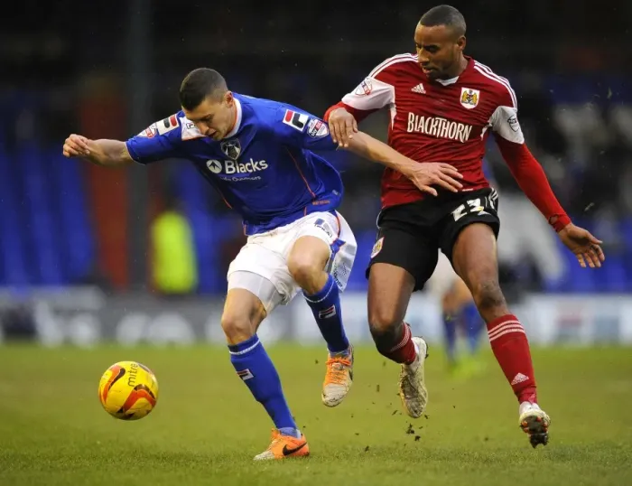 Framed Print : Battling for Possession: Tyrone Barnett vs. James Wilson in Sky Bet League One (Oldham v Bristol City) Framed Print : Battling for Possession: Tyrone Barnett vs. James Wilson in Sky Bet League One (Oldham v Bristol City)
