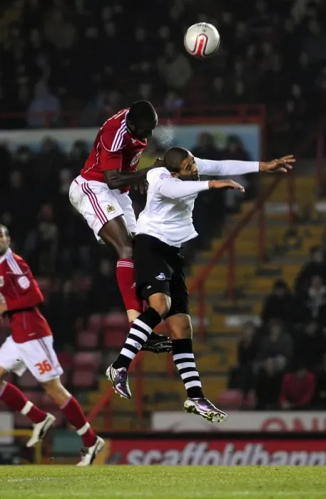 Framed Print : Battling for Supremacy: Damion Stewart vs Luke Moore in the Championship Clash between Bristol City and Swansea City (01 / 02 / 2011) Framed Print : Battling for Supremacy: Damion Stewart vs Luke Moore in the Championship Clash between Bristol City and Swansea City (01 / 02 / 2011)